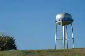 Water tower on a clear day – thinking long-term, reuse systems and efficient plumbing | Burst Pipe Repairs Orange